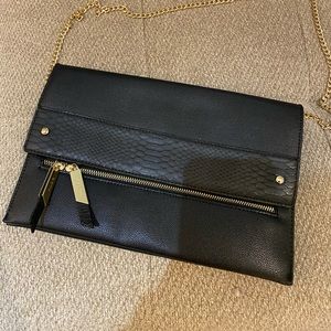 Black Aldo clutch. Magnetic clasps to close. Great condition.